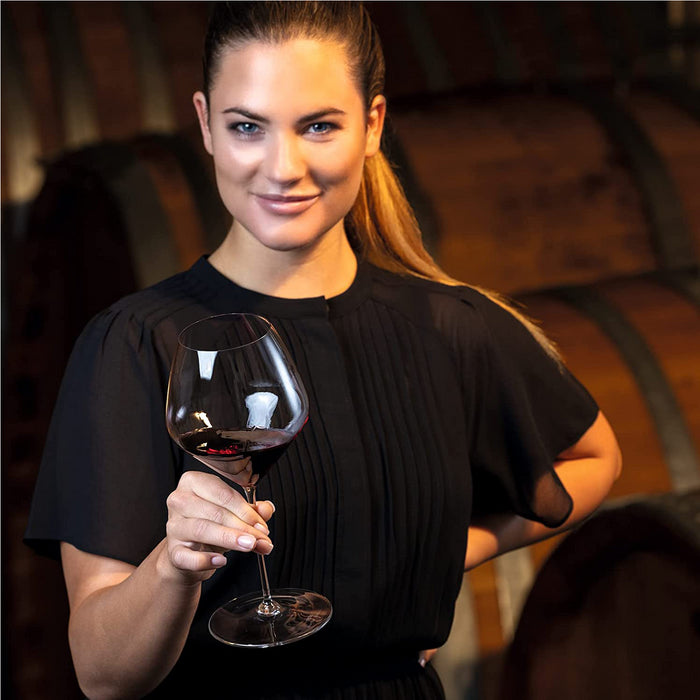 Lady Holding A Riedel Veloce Pinot Noir Wine Glass